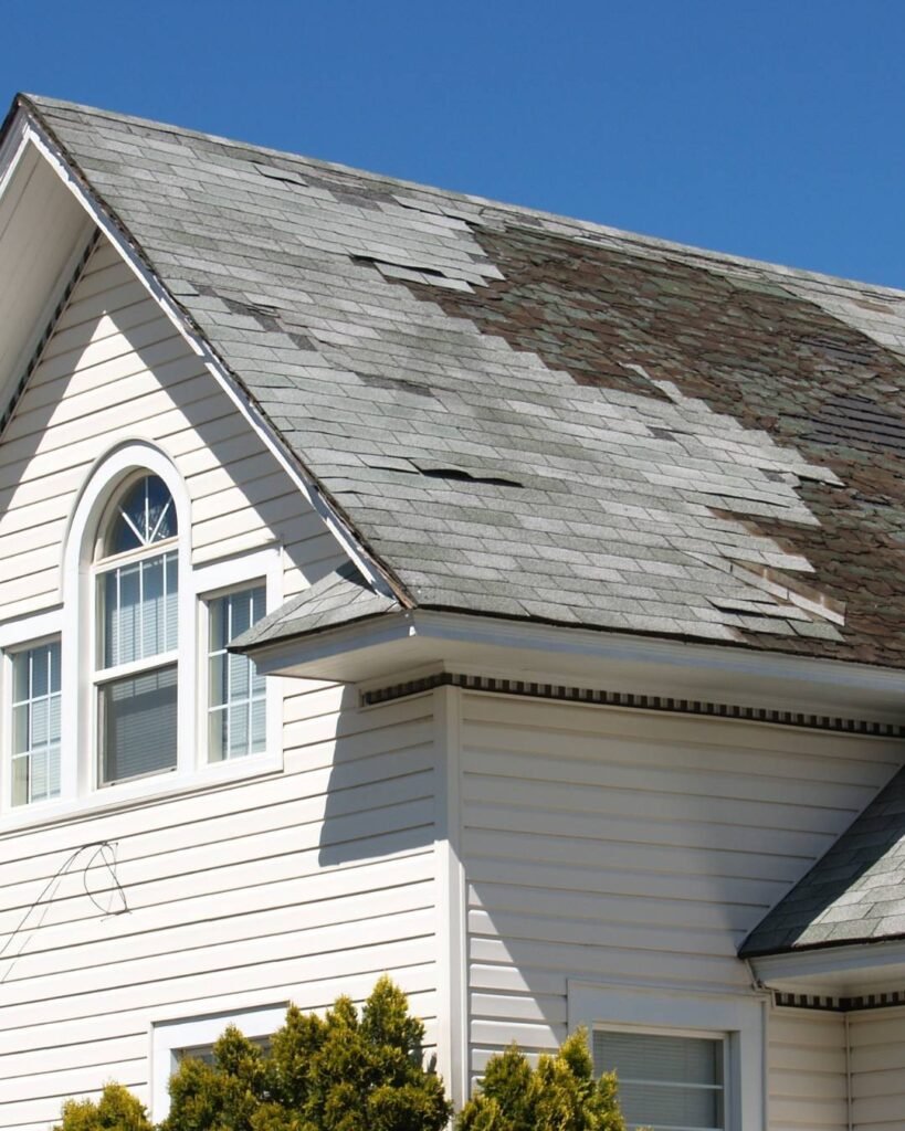 Before work, image of Storm damaged roofing and broken Shingles