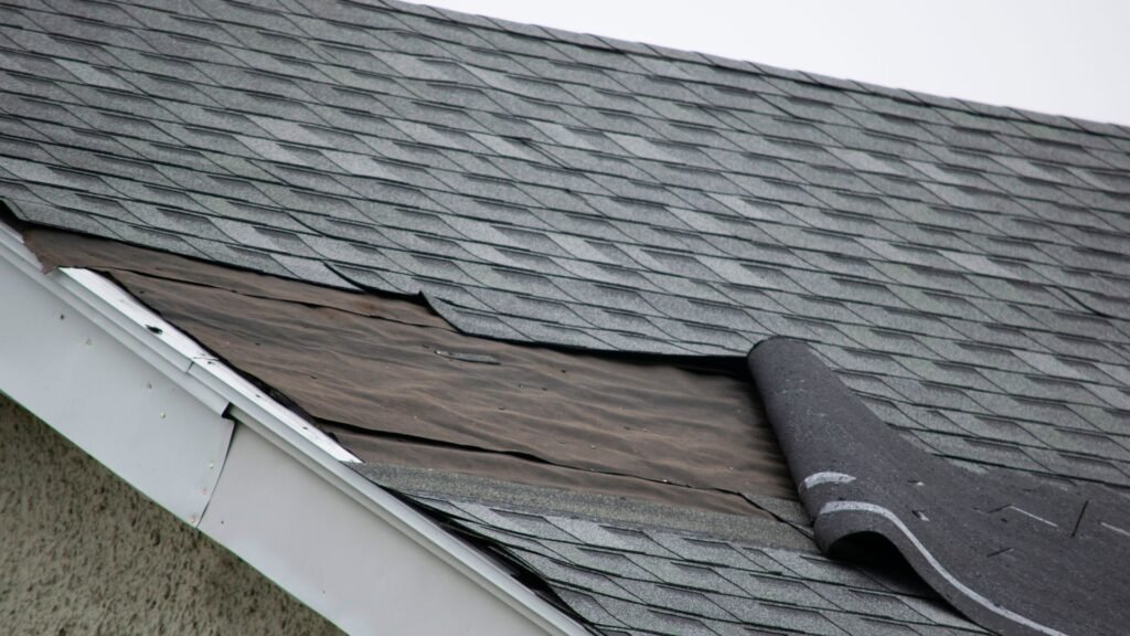 Damaged roof with missing shingles, roof repair by Legends Restoration and Group