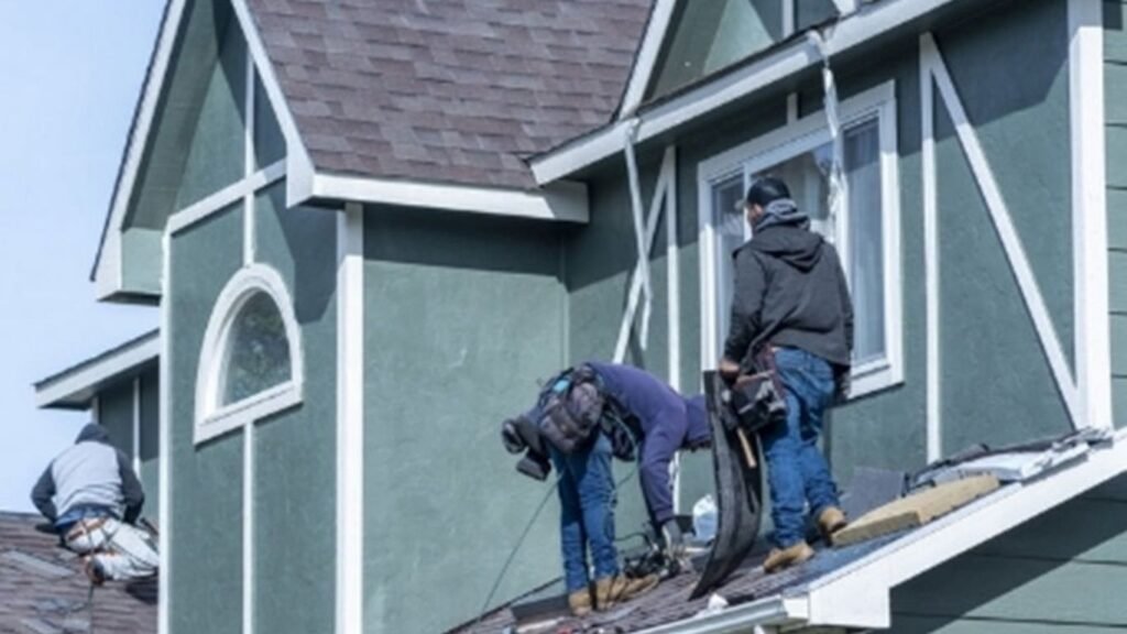 Roofing professionals repairing steep roof – Legends Restoration and Group