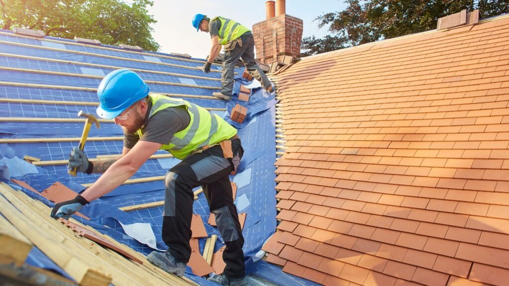Workers installing new roof tiles, roofing service by Legends Restoration and Group