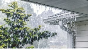 Storm protection for your home in Snellville, GA. Snow buildup on gutter during winter