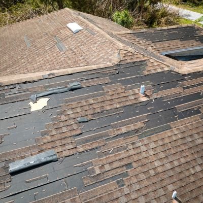 Roof with broken shingles, repair service by Legends Restoration and Group