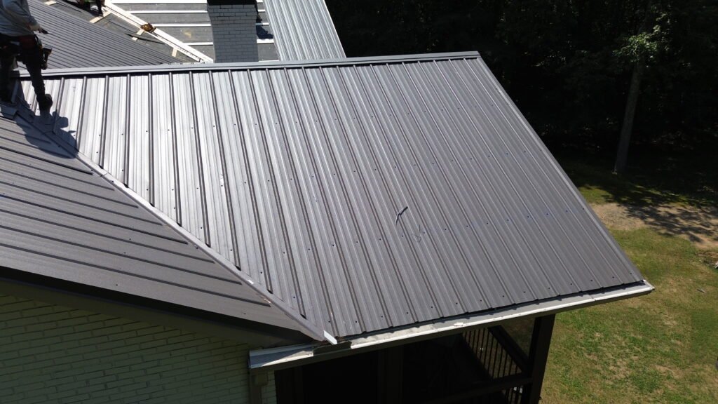 Roofing Contractor in Acworth, GA installing new architectural shingles on a residential home with a steep-slope roof