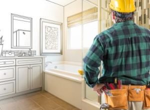 Home remodeling contractor inspecting kitchen project – Legends Restoration and Group